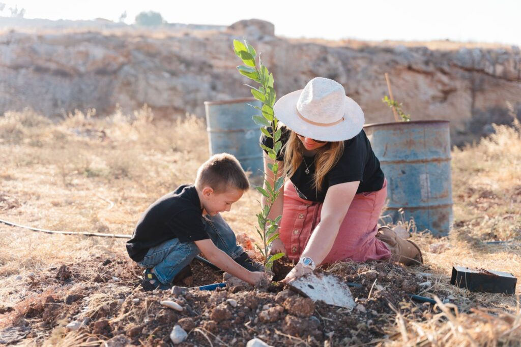 mother and son plant a tree in israel